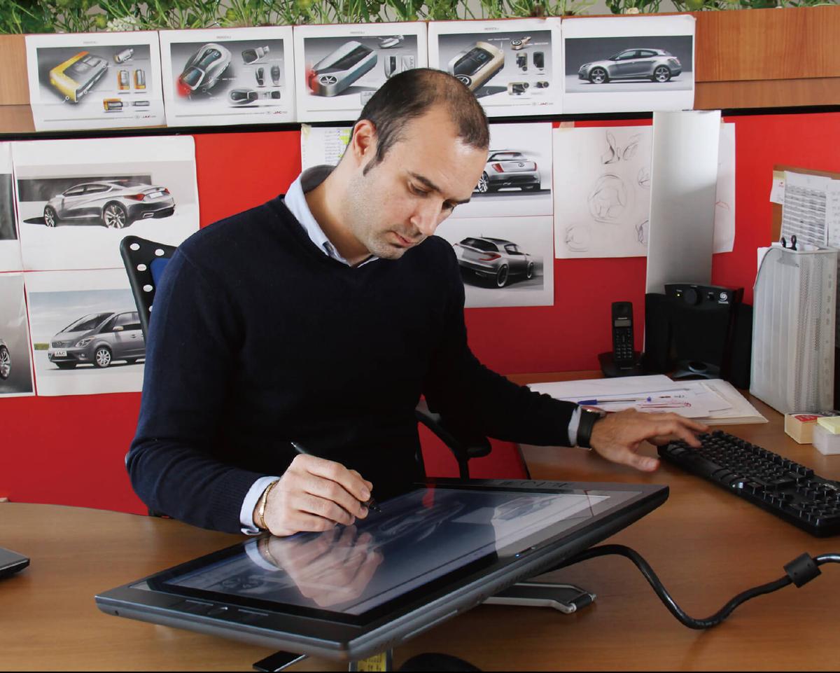 JAC Design Center - Designer working on digital tablet