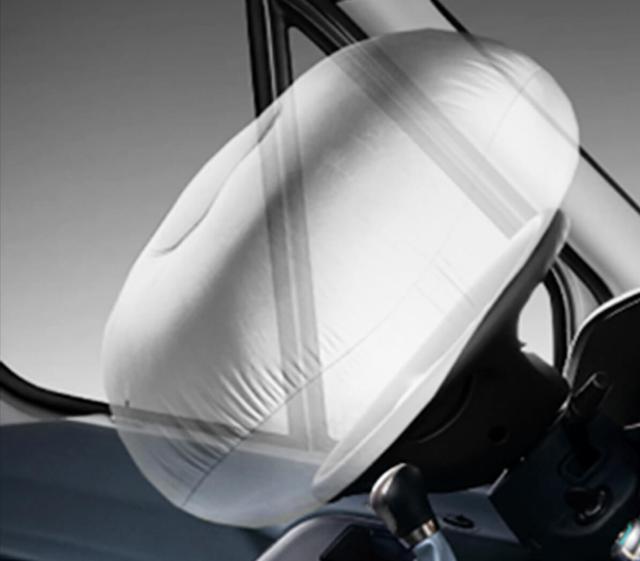 Airbag deployment from steering wheel